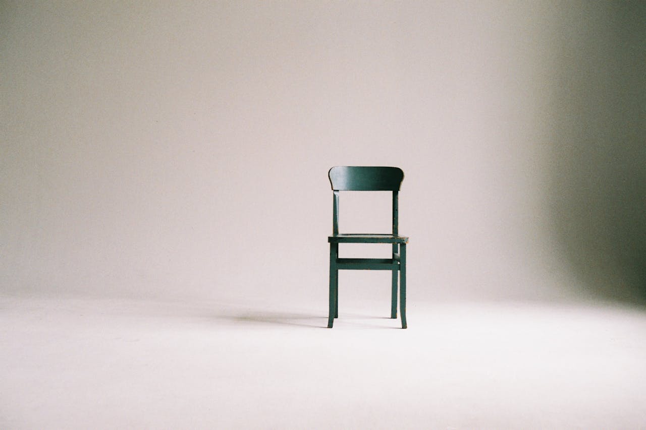 Wooden Chair on a White Wall Studio